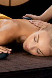 Woman receiving a hot stone massage